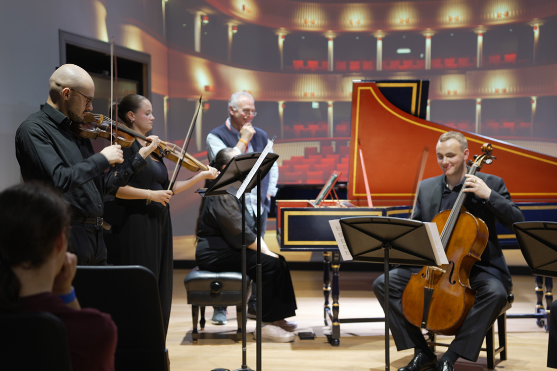 A group of students performing an ensemble with historical instruments.